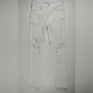 Free People women's size 27 white distressed jeans.